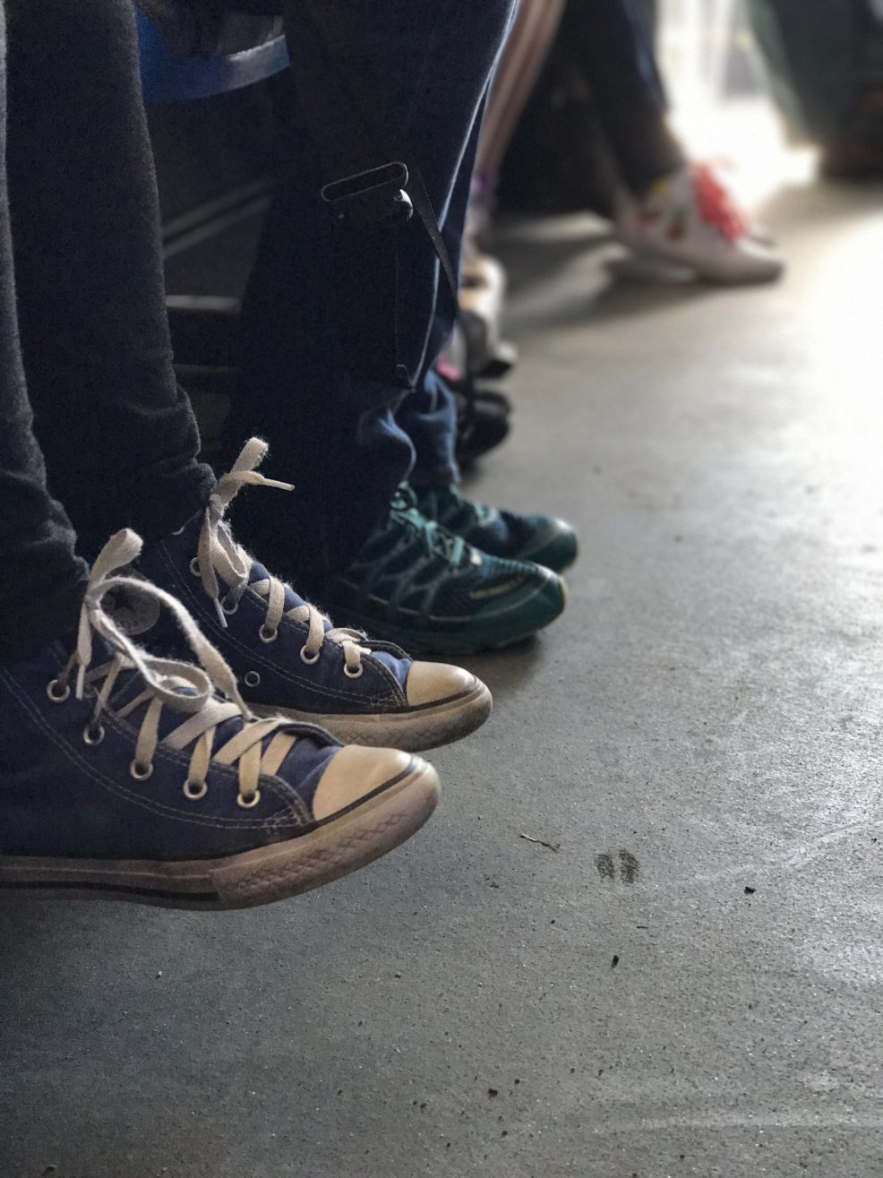 close up of bus rider sneakers