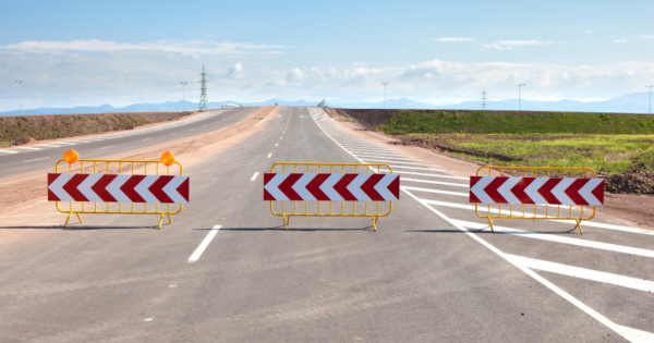 deserted highway with detour signs