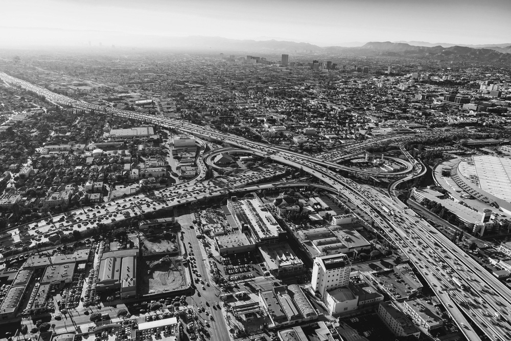 black and white aerial view of a city highway system