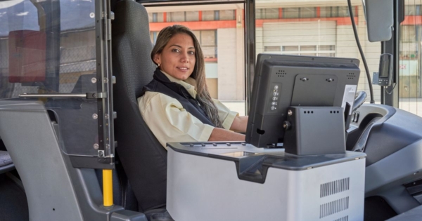 a women bus driver at the wheel