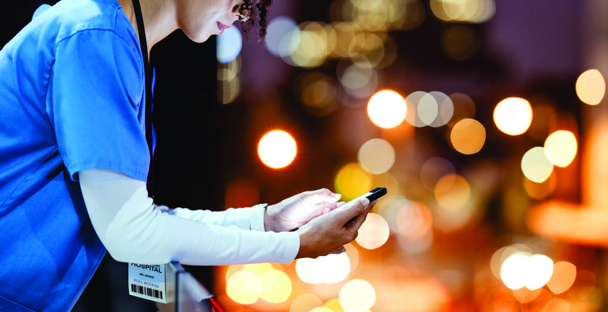 female healthcare worker using cell phone